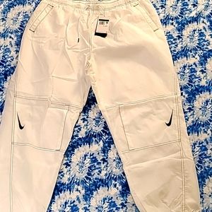 NIKE REPEL OVERSIZED HIGH RISE LOOSE PANTS.  SIZE XL
